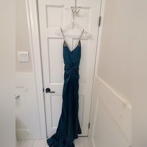 Nicole Miller size 4 gown, midnight blue color with gold detailing.